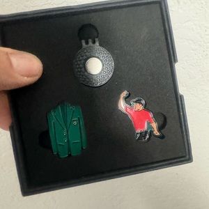 Masters green jacket golf ball marker set 
2 ball markers plus 1 hat clip